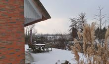 Winteridylle am Reetdachhaus