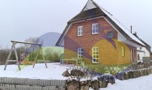 Winteridylle am Reetdachhaus