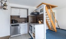 Wohnzimmer TV und Kamin im 1.OG