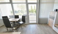 Loungeecke mit Grillplatz im Garten