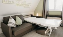 Chillout-Lounge mit Schlafsofa