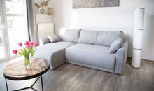 Wohnzimmer mit Schlafsofa