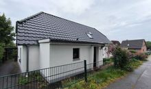 Ferienwohnung mit Sitzecke hinter dem Haus