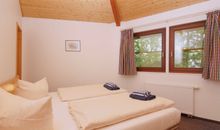 Schlafzimmer im Strandbungalow-Apartment