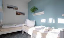 Das zweite Schlafzimmer mit zwei Einzelbetten