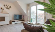 Schneckenhaus Ferienhaus - Blick auf das gemütliche Sofa