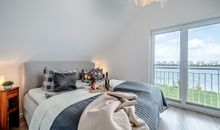 Ferienhaus An der Ostsee by Seeblick Ferien ORO, direkte Wasserlage,Sauna,E-Säule