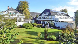 large garden with seating area and lawn